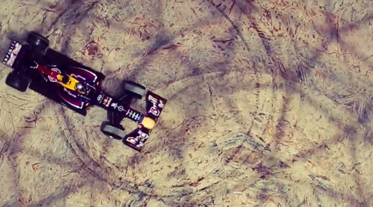 Carlos Sainz Jr drives a Red Bull RB7 inside Yas Mall, Abu Dhabi